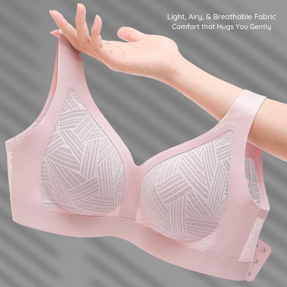 Lilac pink Lace-Illusion Soft Mesh Wireless Bra held by a hand against a gray background